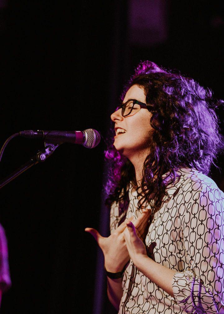 Madds Buckley singing on stage